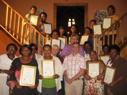 Teachers with certificates at the graduation ceremony